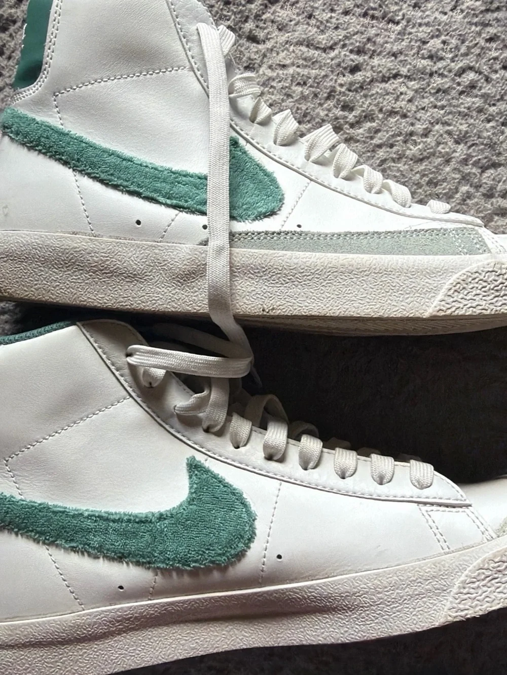 Nike White Low-Top Sneakers with Green Fuzzy Swoosh